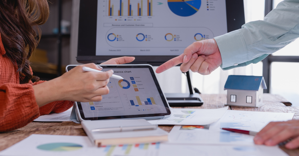 People with tablets analyzing charts