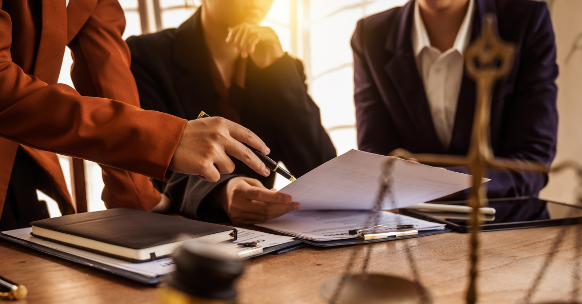 Attorneys having a meeting at desk