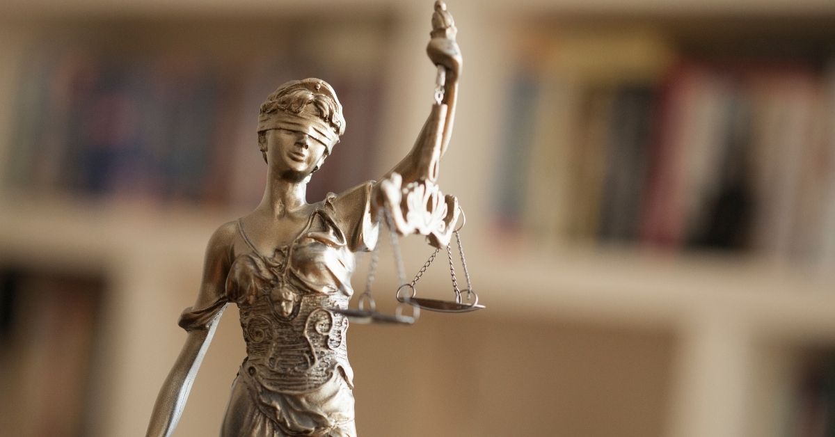 Woman with scales of justice statue